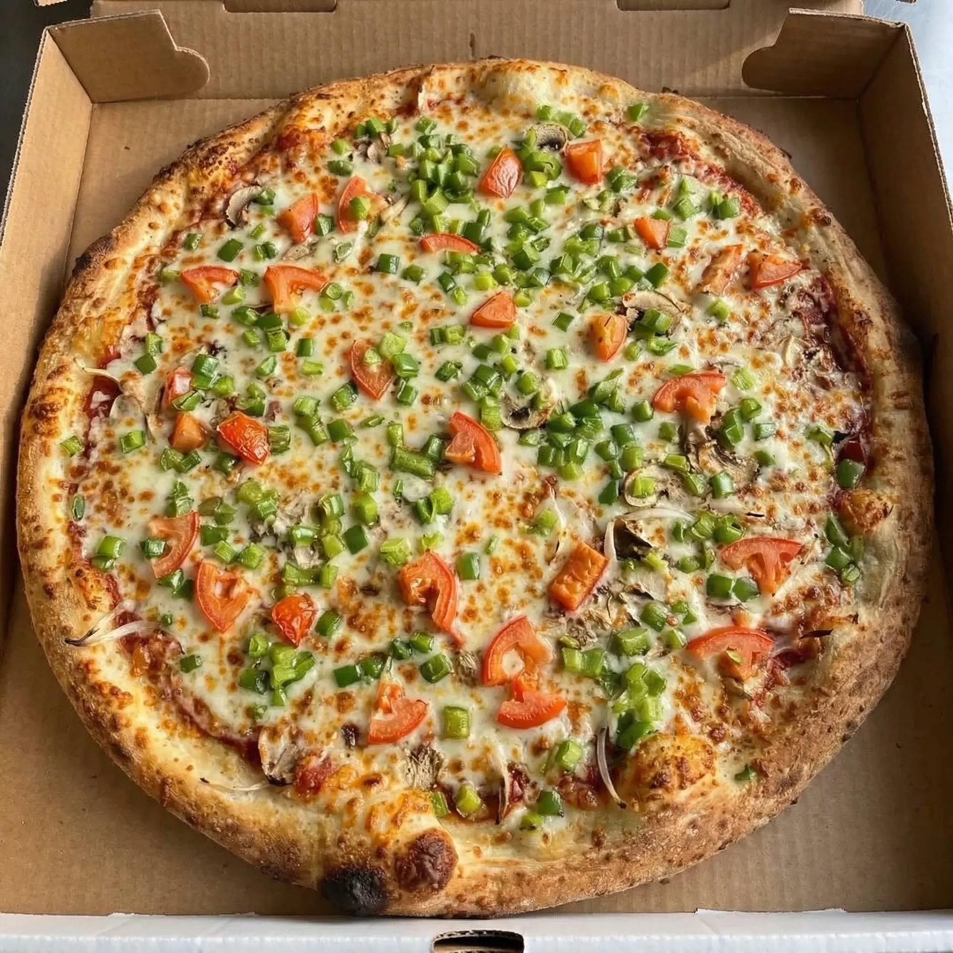 Veggie pizza at Pangaea Pizza NW Calgary - loaded with fresh vegetables and quality ingredients