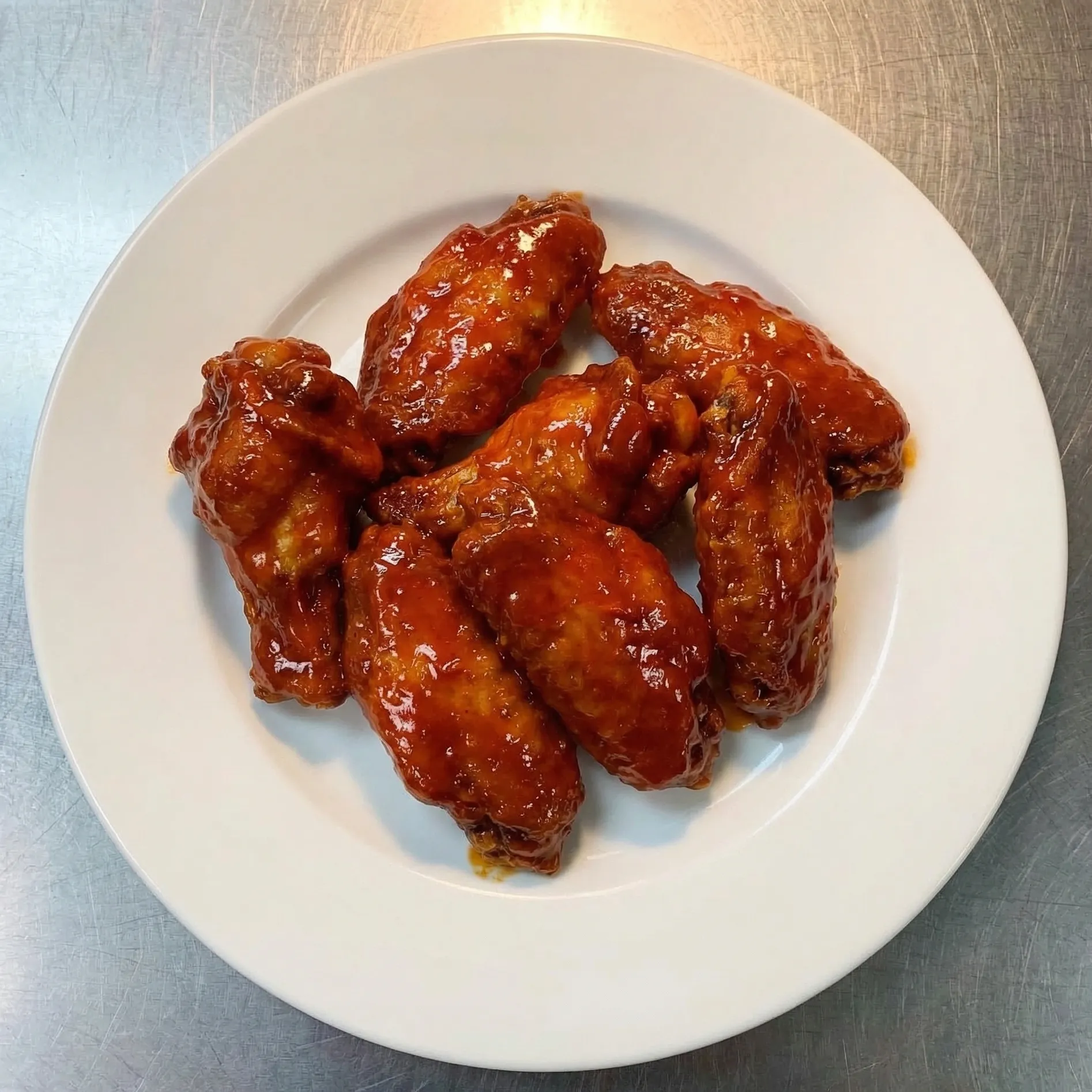 Crispy chicken wings at Pangaea Pizza NW Calgary - big, slightly battered wings with dipping sauces